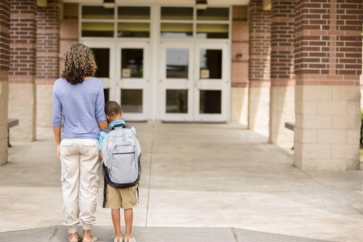nervous student is afraid to go into school before a test