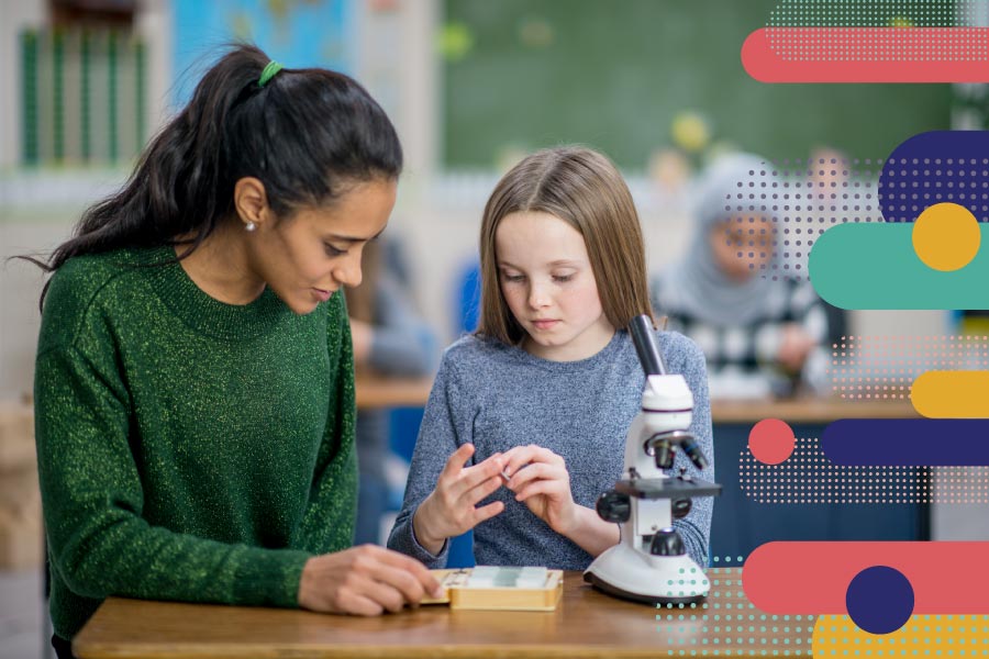 A teacher and student working together on science lesson
