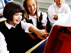 Students pointing at computer