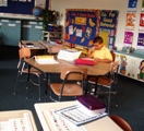 Boy sitting in elementary classroom