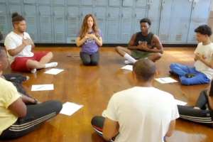 Teachers in a self-care breathing circle