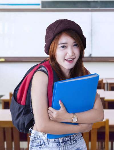 Student holding a portfolio