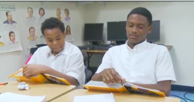 Teacher working with student