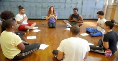 Teachers in a self-care breathing circle