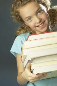 Young girl carrying books